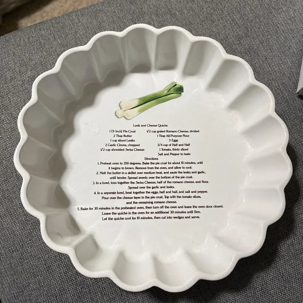 This is a vintage white ceramic quiche or flan baking dish